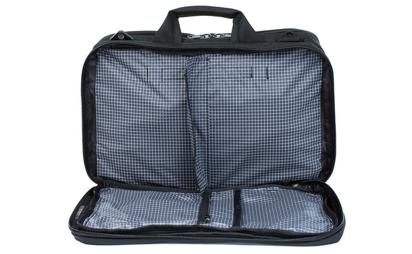 A front shot of the front pocket of a Black 525 Ballistic exterior open showing the Steel (dark grey) 200 Halcyon interior's zippered divider unzipped.